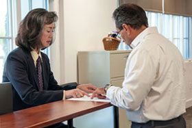 Pyong Lewis helping a customer